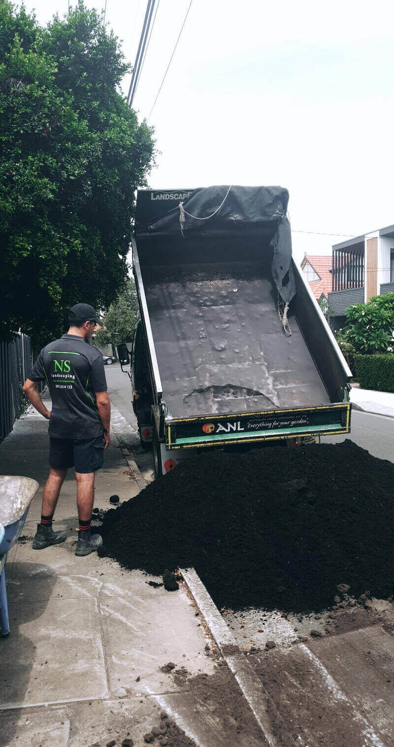 Soil delivery during landscaping work